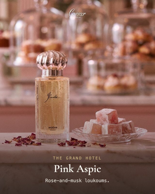 Campaign ad: a perfume bottle beside rose loukoums